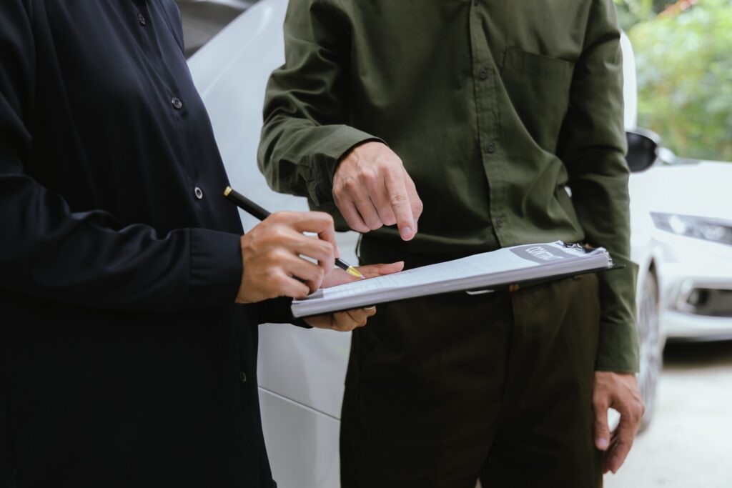 Hill & Associates attorney reviewing a Philadelphia insurance denial with a car accident victim.