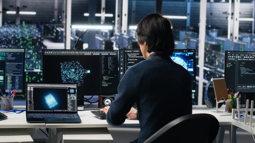 An engineer reviewing digital blueprints for potential design defects and safety risks before a product enters production.