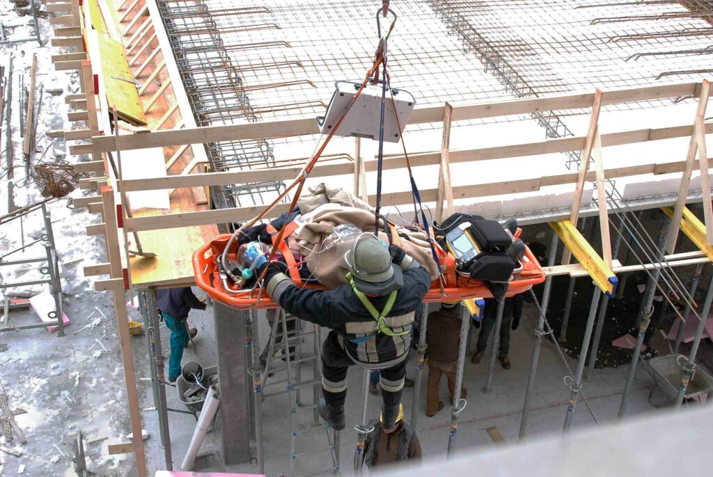 A construction worker requiring emergency rescue after a serious job site accident, highlighting the potential for a third-party construction claim in Philadelphia against negligent contractors.